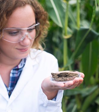 female-agronomist-specialist-examining-soil-sample-fertility-potential